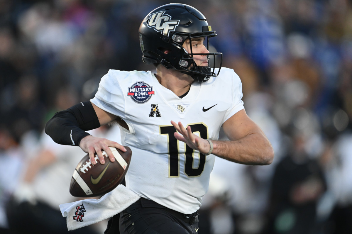 Dec 28, 2022; Annapolis, Maryland, USA; Central Florida Knights quarterback John Rhys Plumlee (10) throws own the run during the second half against the Duke Blue Devils in the 2022 Military Bowl at Navy-Marine Corps Memorial Stadium. Mandatory Credit: Tommy Gilligan-USA TODAY Sports