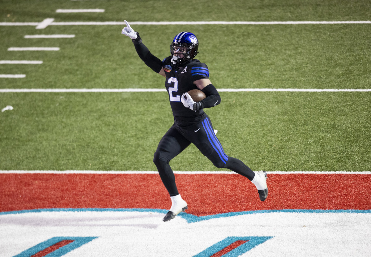 Dec 17, 2022; Albuquerque, New Mexico, USA; Brigham Young Cougars linebacker Ben Bywater (2) celebrates as he runs back an interception for a touchdown against the Southern Methodist Mustangs at University Stadium (Albuquerque). Mandatory Credit: Ivan Pierre Aguirre-USA TODAY Sports