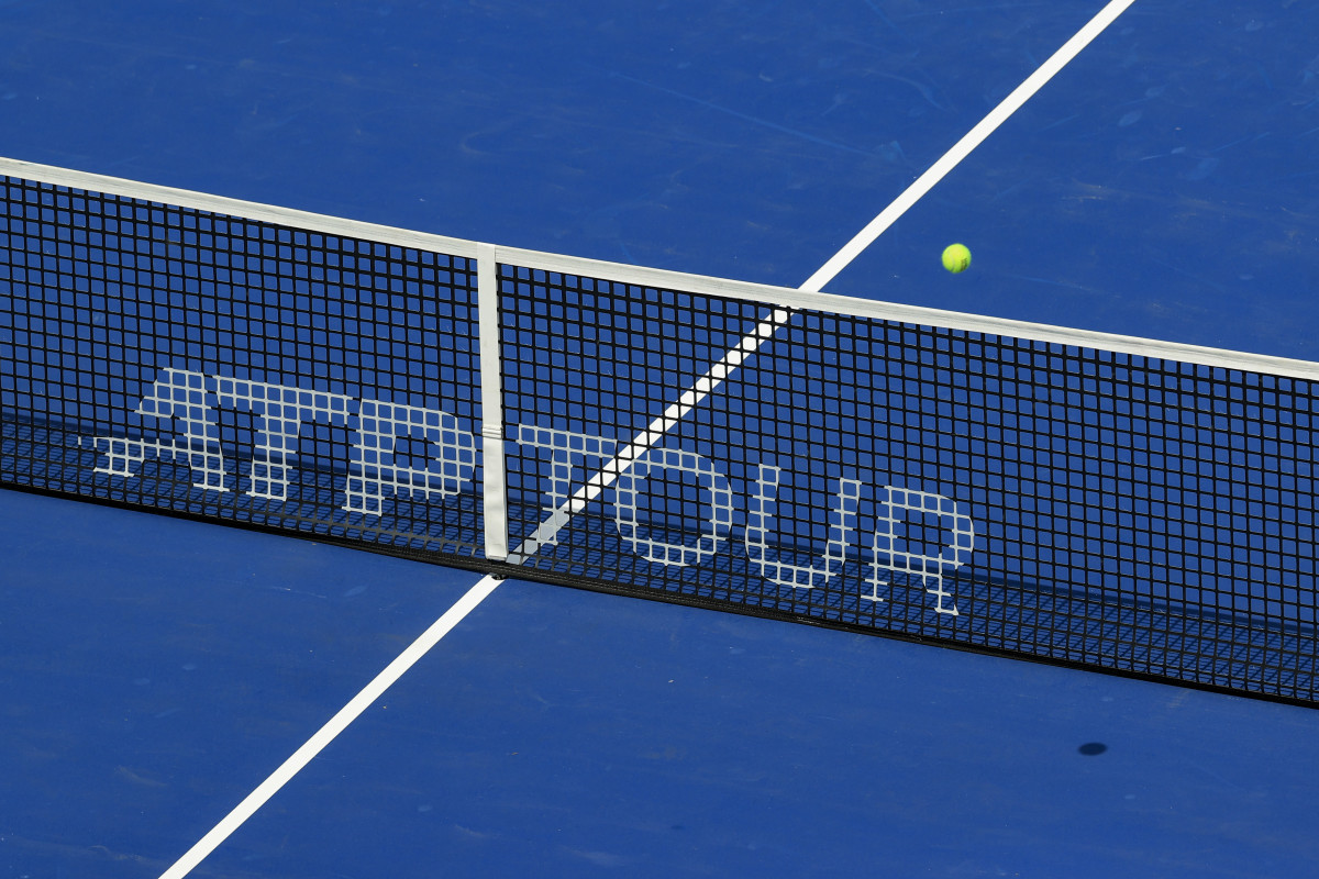 a tennis net with ATP Tour printed on it