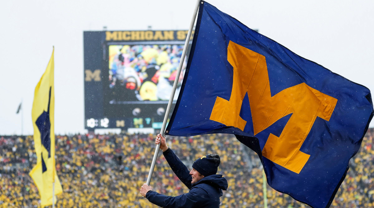 Michigan spirit squad celebrates a touchdown against Ohio State during the first half at Michigan Stadium.