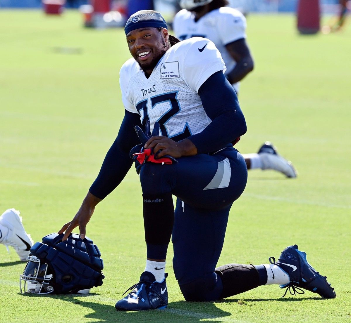Tennessee Titans running back Derrick Henry (22) stretches during training camp practice on Aug. 1, in Nashville, Tenn. (Mark Zaleski/USA TODAY Sports)