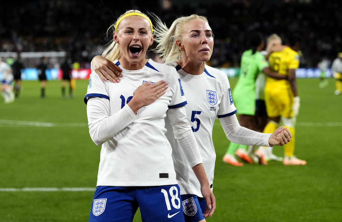 England's Chloe Kelly puts her hand over the crest on her jersey after scoring the game-winning penalty shot against Nigeria in the round of 16 at the Women's World Cup.