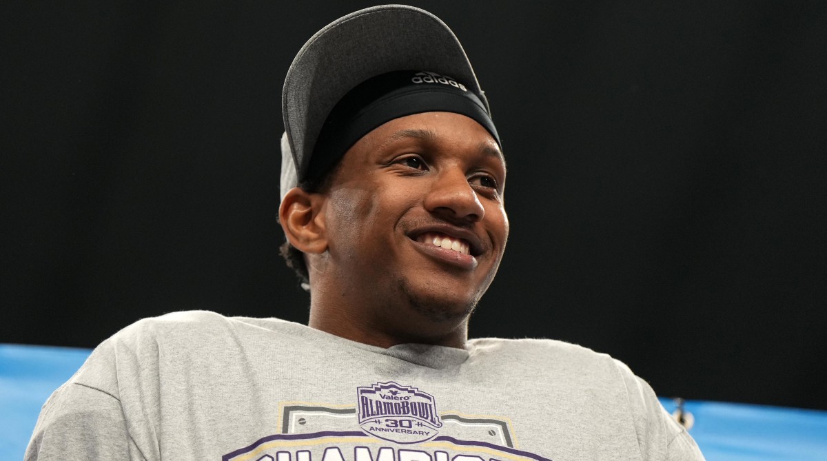 Washington quarterback Michael Penix Jr. in a T-shirt and hat after winning the Alamo Bowl