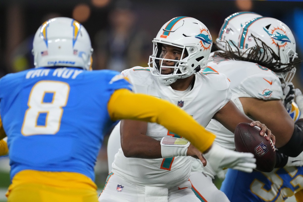 Miami Dolphins quarterback Tua Tagovailoa (1) throws the ball under pressure from Chargers linebacker Kyle Van Noy (8). Mandatory Credit: Kirby Lee-USA TODAY