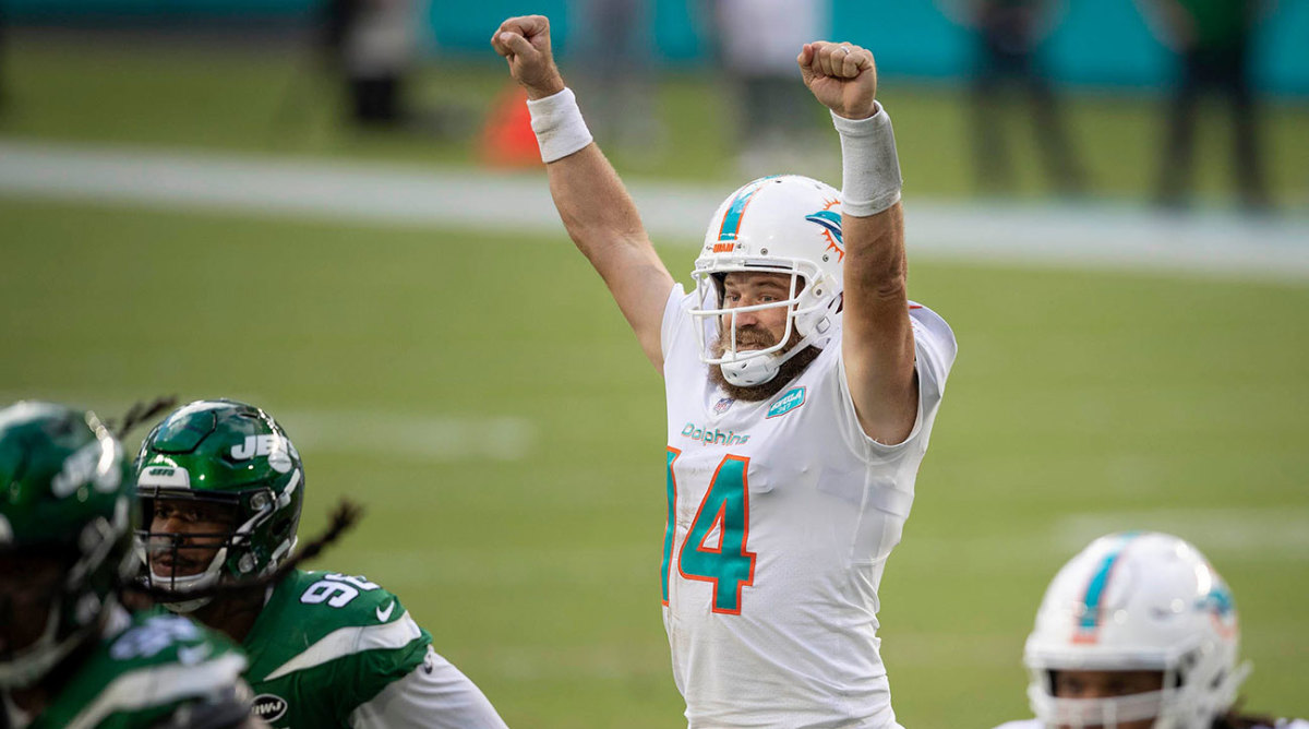 Ryan Fitzpatrick puts his arms up to celebrate as a member of the Dolphins.