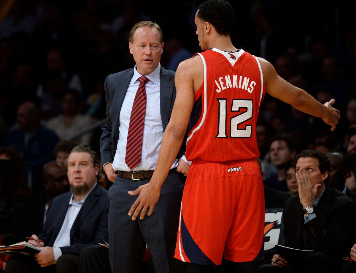 Atlanta Hawks head coach Mike Budenholzer talks to Atlanta Hawks shooting guard John Jenkins (12) during the first half against Los Angeles Lakers at Staples Center.
