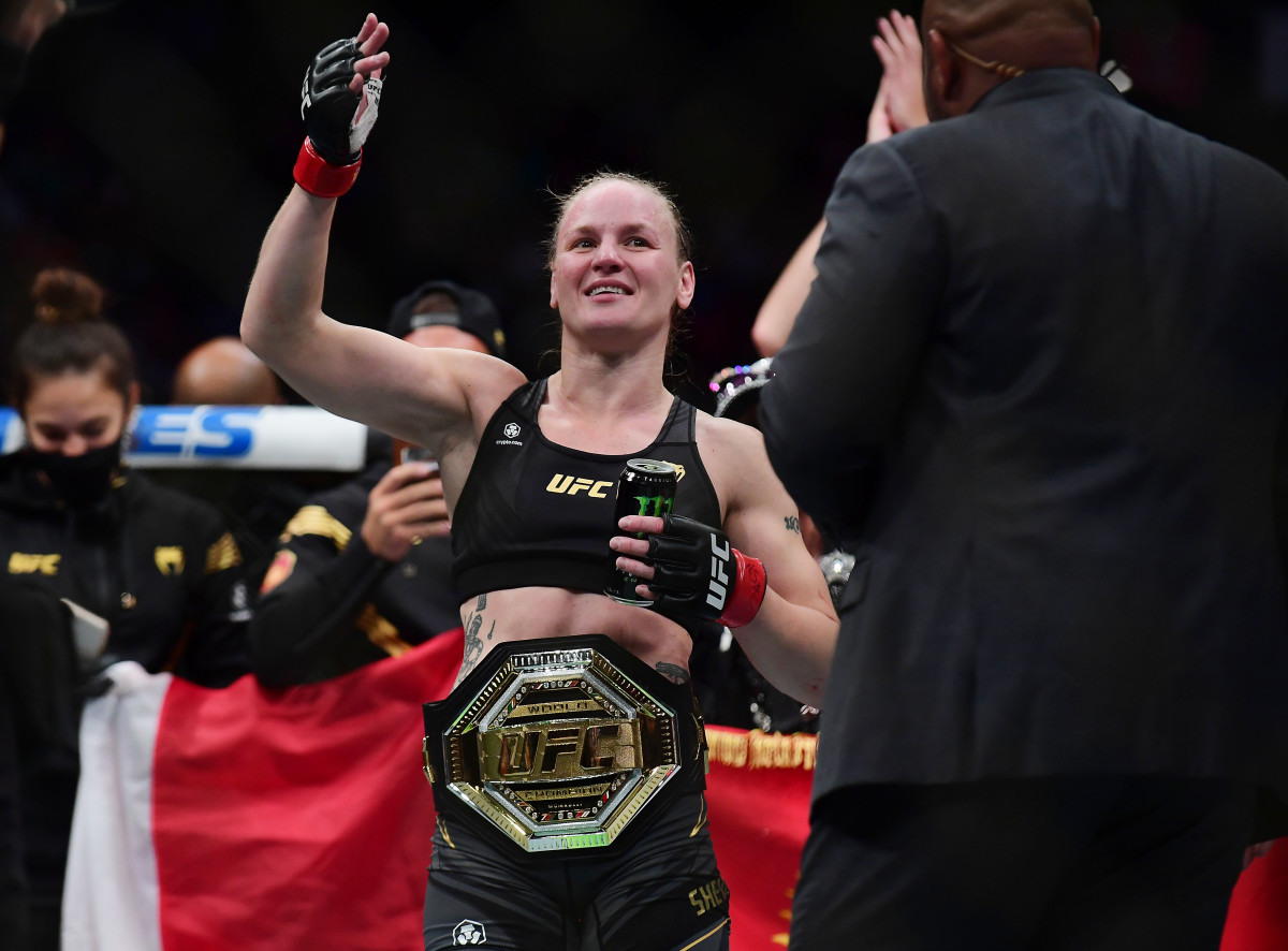 Valentina Shevchenko celebrates her TKO victory and title defense against Lauren Murphy during UFC 266 at T-Mobile Arena.