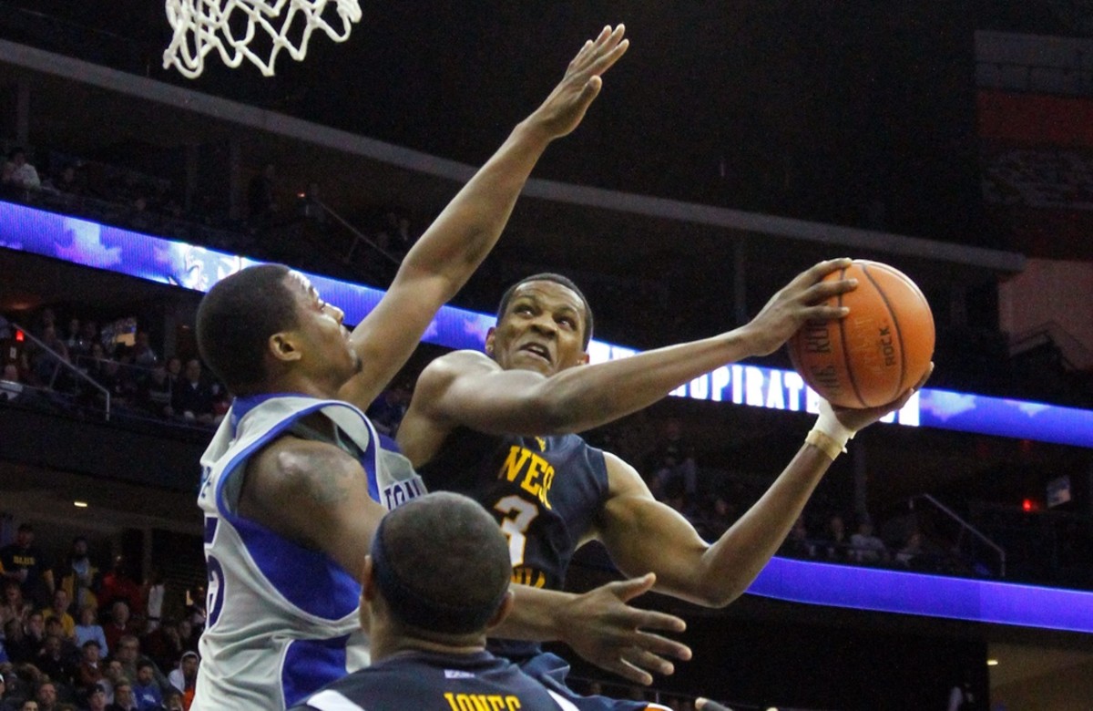 Dec 26, 2009; Newark, NJ, USA; West Virginia Mountaineers forward Devin Ebanks (3) drives to the basket during second half action against Seton Hall Pirates forward Herb Pope (15) at the Prudential Center. West Virginia won 90-84 in overtime.