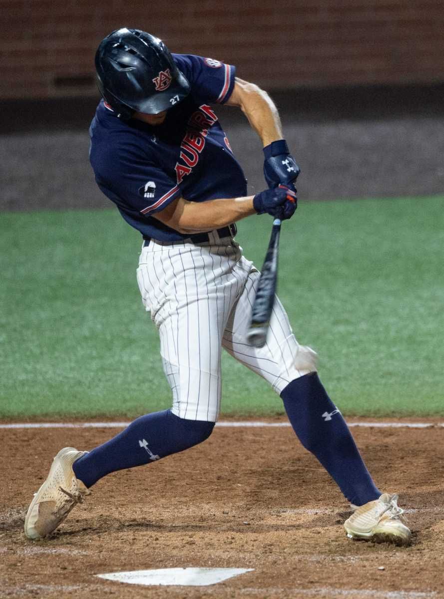Auburn Tigers outfielder Bobby Peirce (27) swings at the ball as Auburn Tigers take on UCLA Bruins during the NCAA regional baseball tournament at Plainsman Park in Auburn, Ala., on Sunday, June 5, 2022.