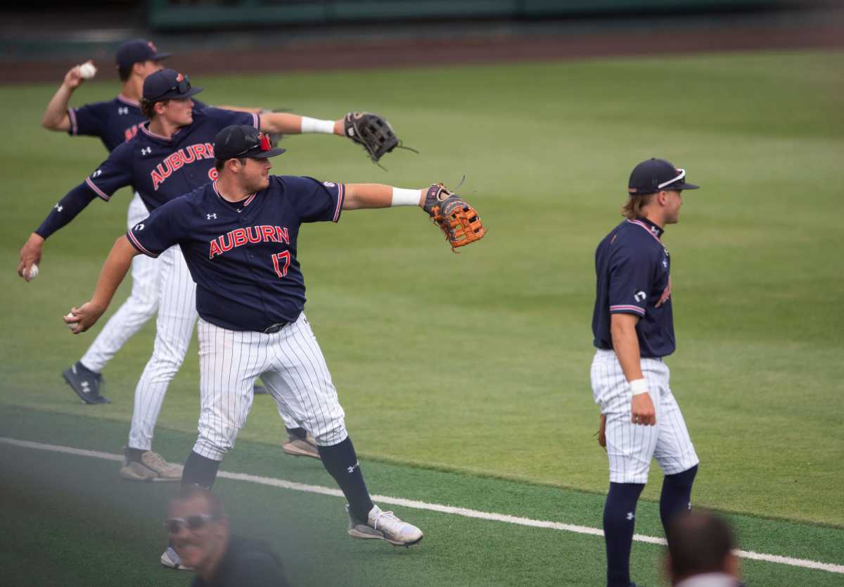 Auburn Tigers players warm up as Auburn Tigers take on UCLA Bruins during the NCAA regional baseball tournament at Plainsman Park in Auburn, Ala., on Sunday, June 5, 2022.