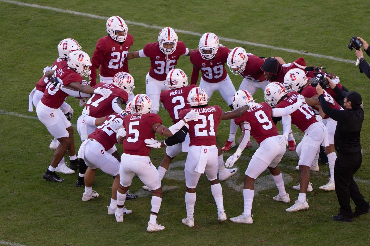 Stanford Cardinal safety Jonathan McGill (2) hypes up his teammates during a huddle before the start of the game against the California Golden Bears at Stanford Stadium.