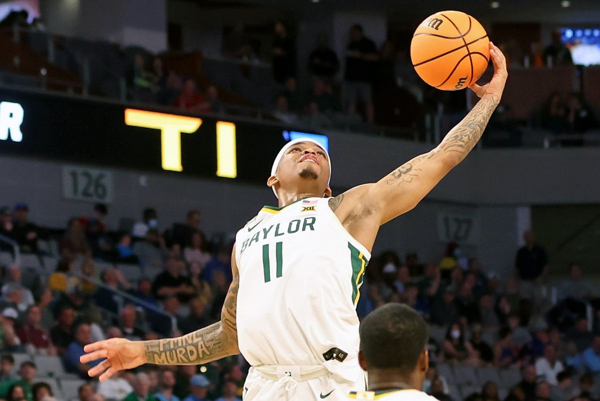 Baylor Bears guard James Akinjo (11) grabs a loose ball against the Norfolk State Spartans during the first half during the first round of the 2022 NCAA Tournament at Dickies Arena.