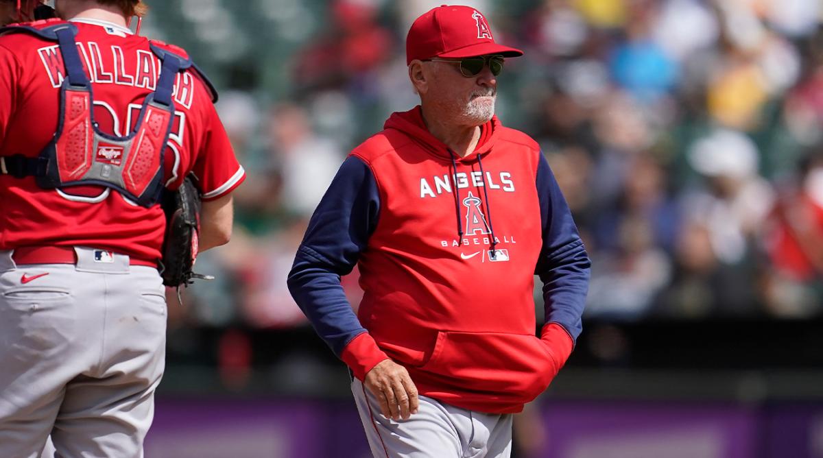 Los Angeles Angels manager Joe Maddon walks to the dugout after making a pitching change during the seventh inning of his team’s baseball game against the Oakland Athletics in Oakland, Calif., Sunday, May 15, 2022.