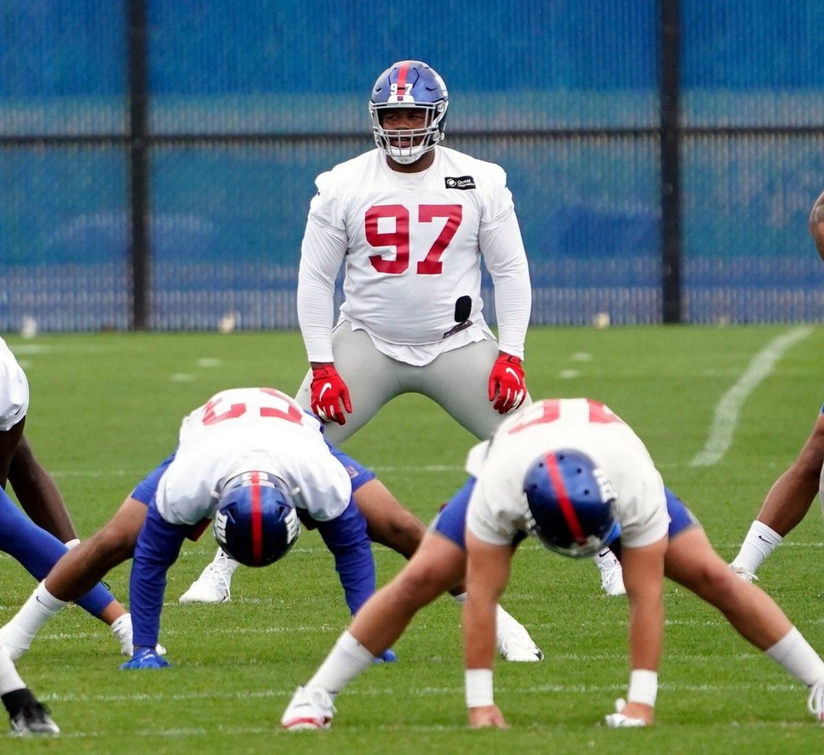 New York Giants tackle Dexter Lawrence (97) stretches during OTA practice at the Quest Diagnostics Training Center on Friday, June 4, 2021, in East Rutherford.