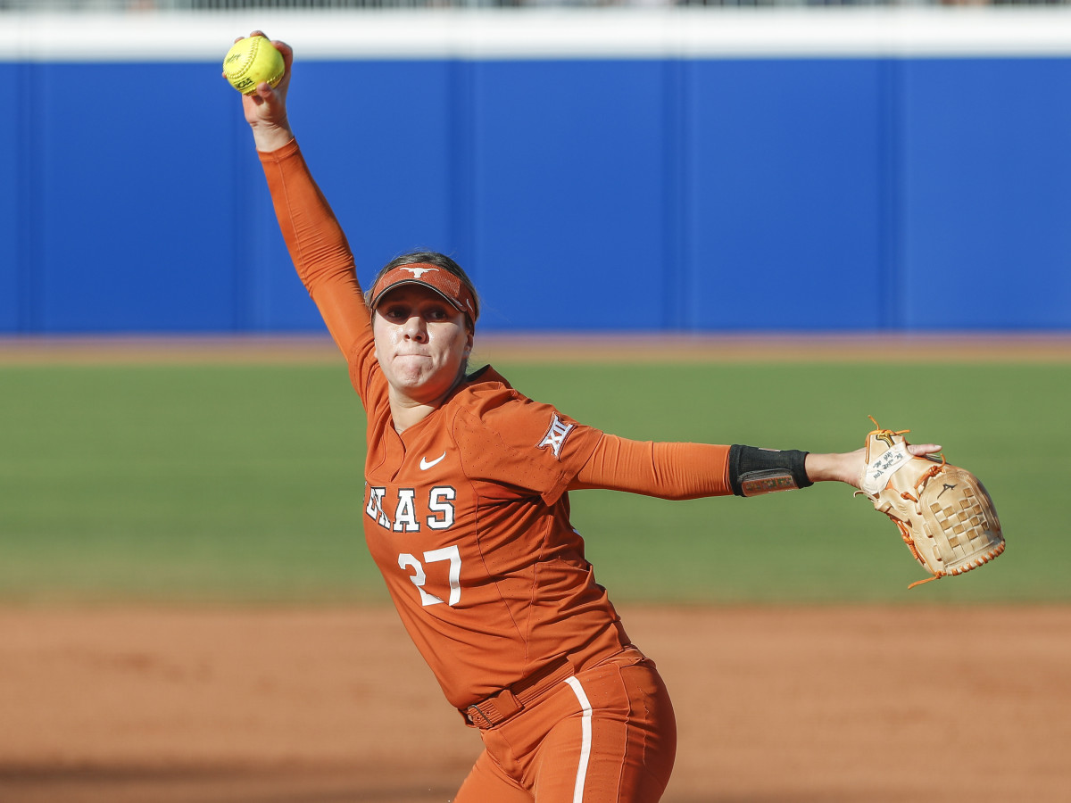 Texas pitcher Hailey Dolcini winds up for a pitch
