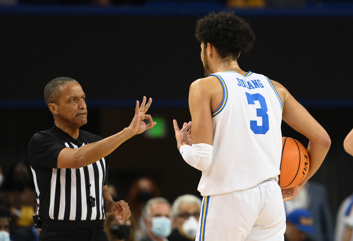 UCLA Bruins guard Johnny Juzang (3) is charged with an offensive foul in the first half of the game against the Washington State Cougars at Pauley Pavilion presented by Wescom.
