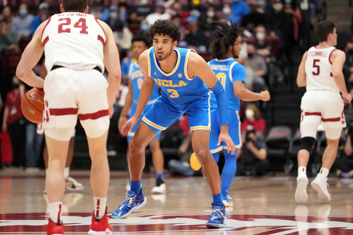 UCLA Bruins guard Johnny Juzang (3) guards Stanford Cardinal guard Sam Beskind (24) during the first half at Maples Pavilion.