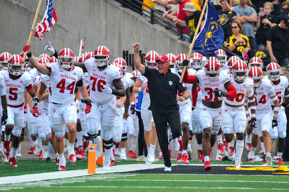 Indiana Hoosiers head coach Tom Allen and his team enter the field before the game against the Iowa Hawkeyes at Kinnick Stadium.