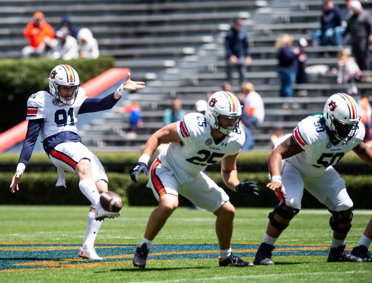 Auburn Tigers punter Oscar Chapman (91) punts the ball during warm ups during the A-Day spring practice at Jordan-Hare Stadium in Auburn, Ala., on Saturday, April 9, 2022.