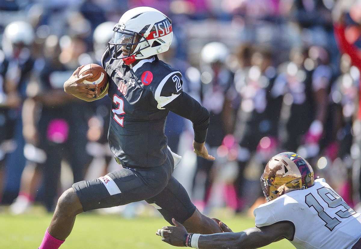Jackson State QB Shedeur Sanders runs past a defender during a 2021 game