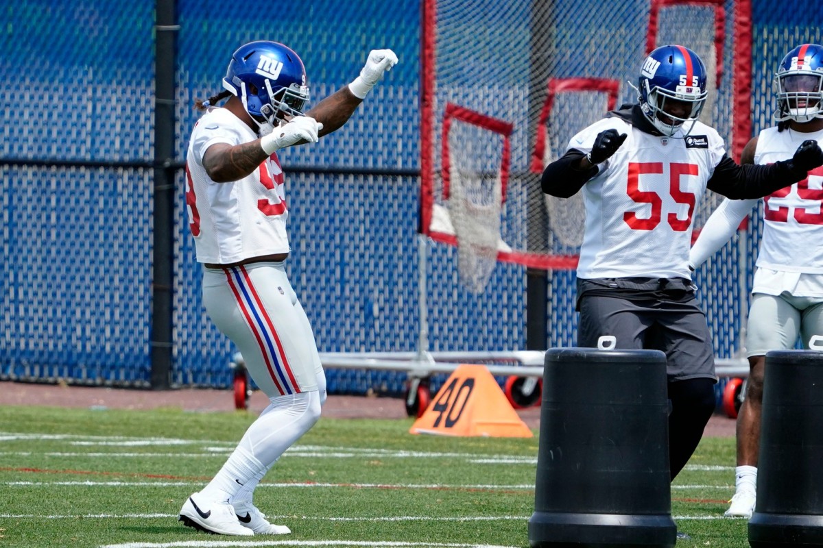 New York Giants defensive end Leonard Williams (99) and linebacker Jihad Ward (55) dance during mandatory minicamp at the Quest Diagnostics Training Center on Tuesday, June 7, 2022, in East Rutherford.