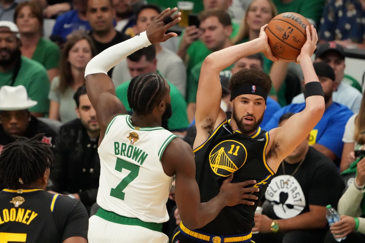 Jun 8, 2022; Boston, Massachusetts, USA; Golden State Warriors guard Klay Thompson (11) looks to pass the ball in front of Boston Celtics guard Jaylen Brown (7) in the first quarter during game three of the 2022 NBA Finals at TD Garden. Mandatory Credit: Kyle Terada-USA TODAY Sports