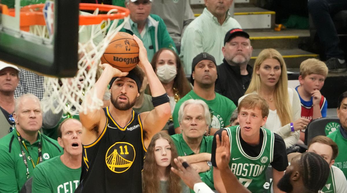 Jun 8, 2022; Boston, Massachusetts, USA; Golden State Warriors guard Klay Thompson (11) attempts a basket in front of Boston Celtics guard Jaylen Brown (7) in the third quarter during game three of the 2022 NBA Finals at TD Garden.