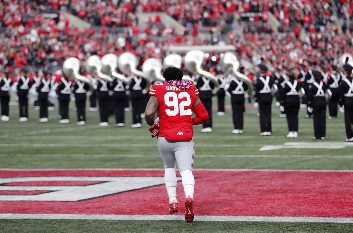 Ohio State Buckeyes defensive tackle Haskell Garrett (92) takes the field during senior day celebrations before their NCAA College football game against Michigan State Spartans at Ohio Stadium in Columbus, Ohio on November 20, 2021.