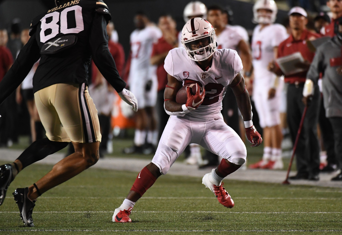 Sep 18, 2021; Nashville, Tennessee, USA; Stanford Cardinal running back E.J. Smith (22) runs for a first down against the Vanderbilt Commodores during the first half at Vanderbilt Stadium.