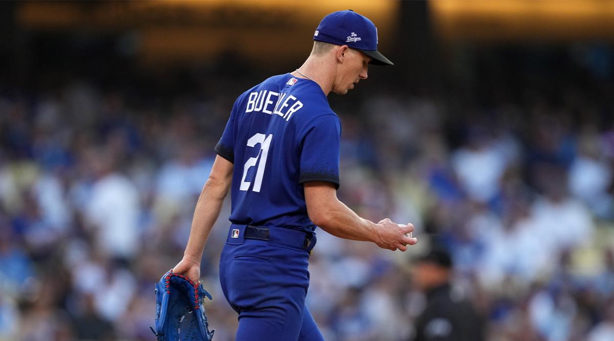Jun 4, 2022; Los Angeles, California, USA; Los Angeles Dodgers starting pitcher Walker Buehler (21) reacts after surrendering a solo home run to New York Mets shortstop Francisco Lindor (not pictured) in the first inning at Dodger Stadium.