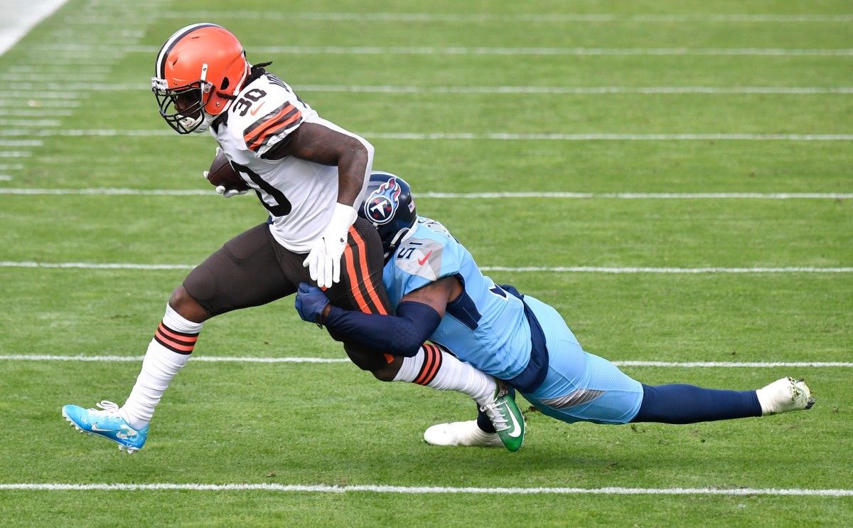 Cleveland Browns running back D'Ernest Johnson (30) is taken down by Tennessee Titans linebacker David Long (51) during the first quarter at Nissan Stadium Sunday, Dec. 6, 2020 in Nashville, Tenn.