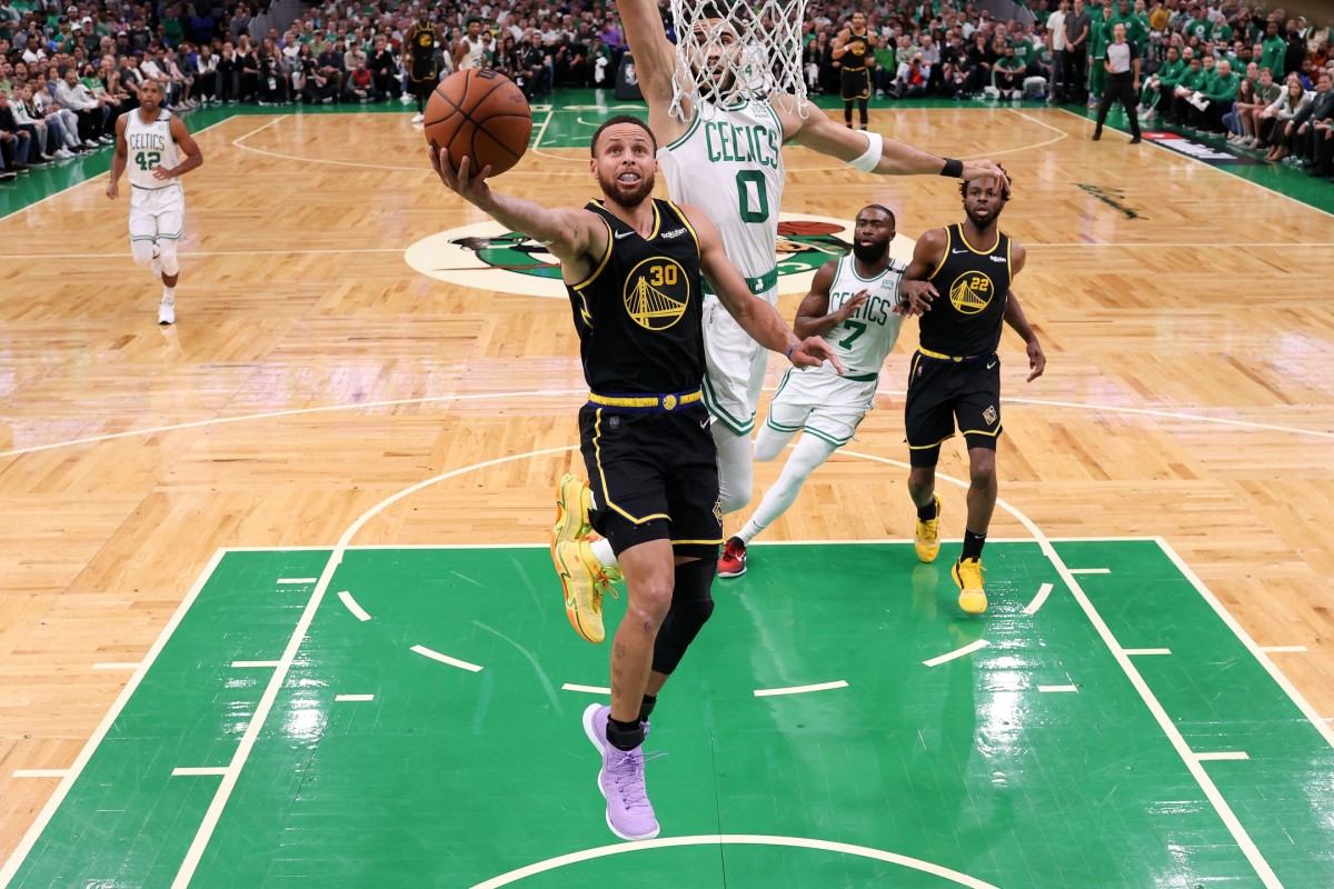 Jun 10, 2022; Boston, Massachusetts, USA; Golden State Warriors guard Stephen Curry (30) attempts a layup against Boston Celtics forward Jayson Tatum (0) during the first half of game four in the 2022 NBA Finals at the TD Garden. Mandatory Credit: Kyle Terada-USA TODAY Sports
