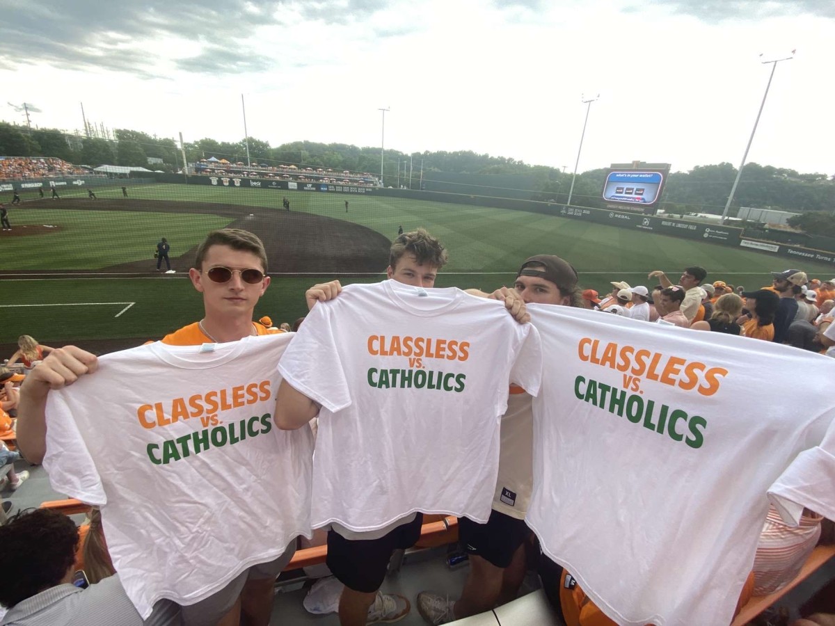 UT students holding up 'Classless vs. Catholics' T-shirts in the LNS Student Section