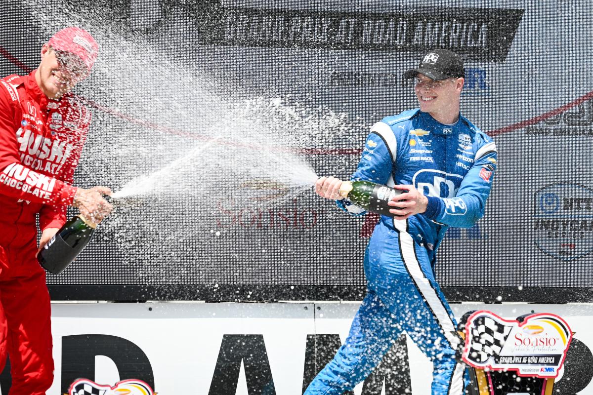 Race winner Josef Newgarden celebrates with runner-up Marcus Ericsson following Sunday's race at Road America. Photo: IndyCar/James Black.