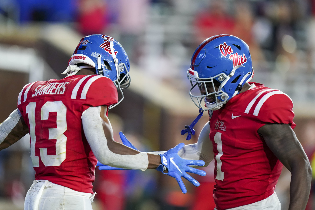 Sep 18, 2021; Oxford, Mississippi, USA; Mississippi Rebels wide receiver Braylon Sanders (13) and Mississippi Rebels wide receiver Jonathan Mingo (1) celebrate after Sanders scores a touchdown against Tulane Green Wave at Vaught-Hemingway Stadium. Mandatory Credit: Marvin Gentry-USA TODAY Sports