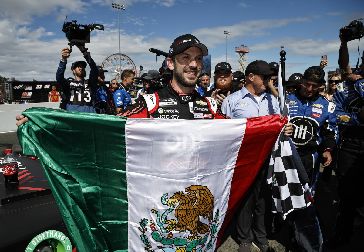 Daniel Suarez proudly displays the flag of his homeland, Mexico, after winning Sunday's Toyota/Save Mart 350 at Sonoma Raceway. (Photo by Chris Graythen/Getty Images)