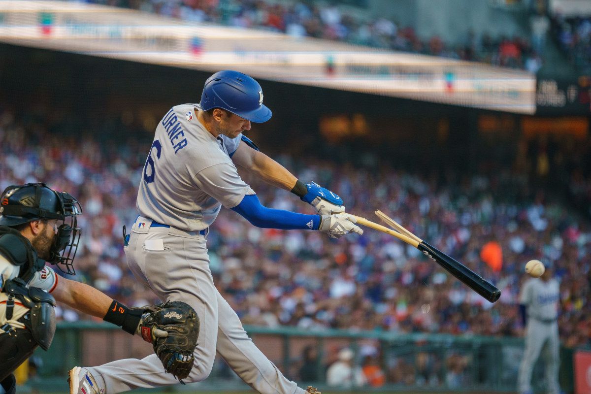 Trea Turner hits a single against the San Francisco Giants.