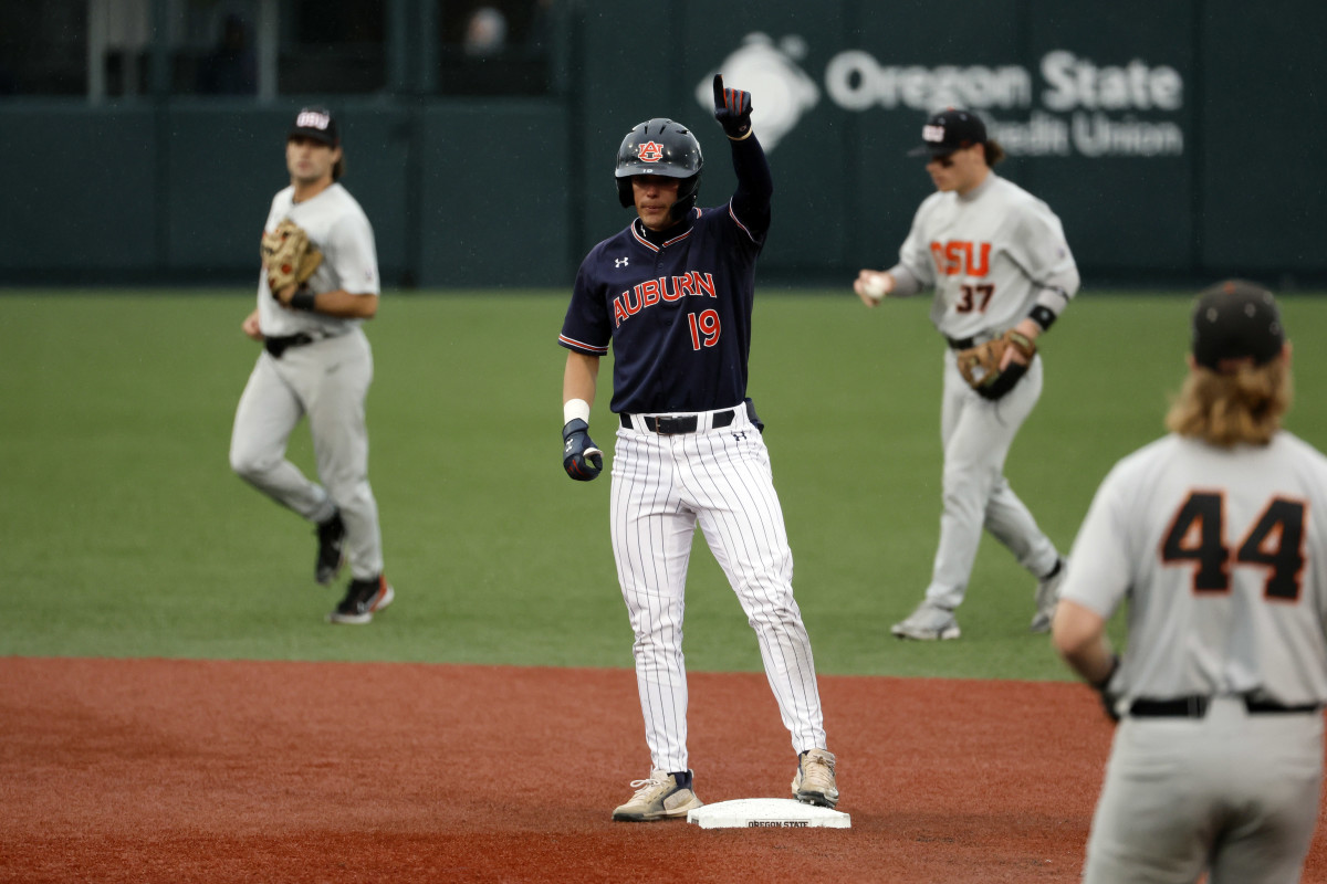 Jun 12, 2022; Corvallis, OR, USA; Auburn Baseball infielder Brooks Carlson (19) celebrates a double against Oregon State in the 4th inning during Game 2 of a NCAA Super Regional game at Coleman Field. Mandatory Credit: Soobum Im-USA TODAY Sports