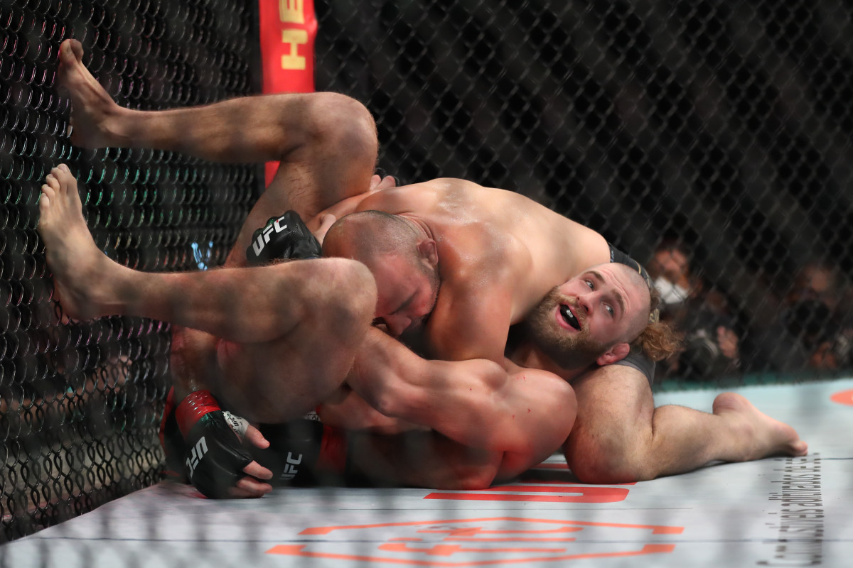 Jiri Prochazka (blue gloves) reacts after the fight against Glover Teixera (red gloves) during UFC 275 at Singapore Indoor Stadium.