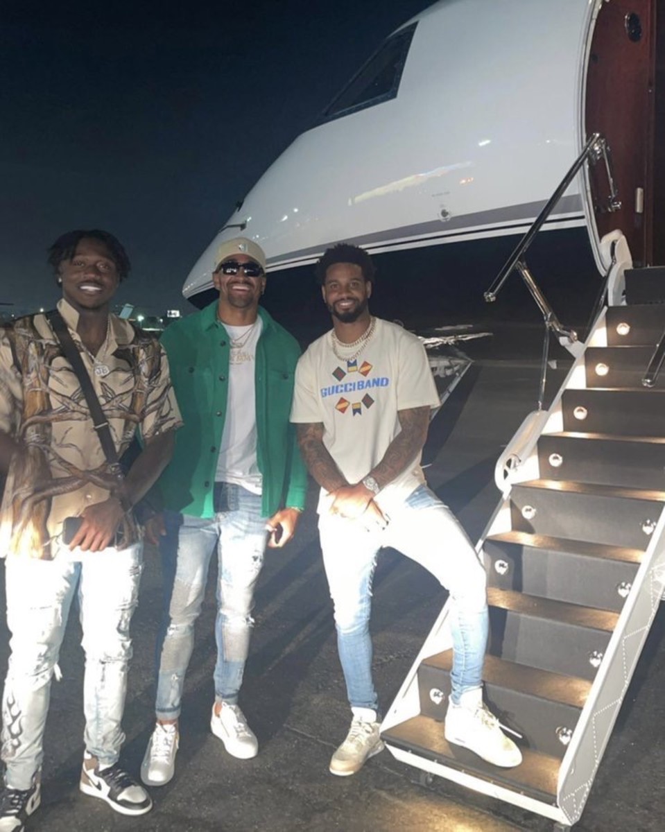 Left to right: A.J. Brown, Jalen Hurts, and Darius Slay get ready to board a plane to Boston to see the Celtics play the Heat in the playoffs