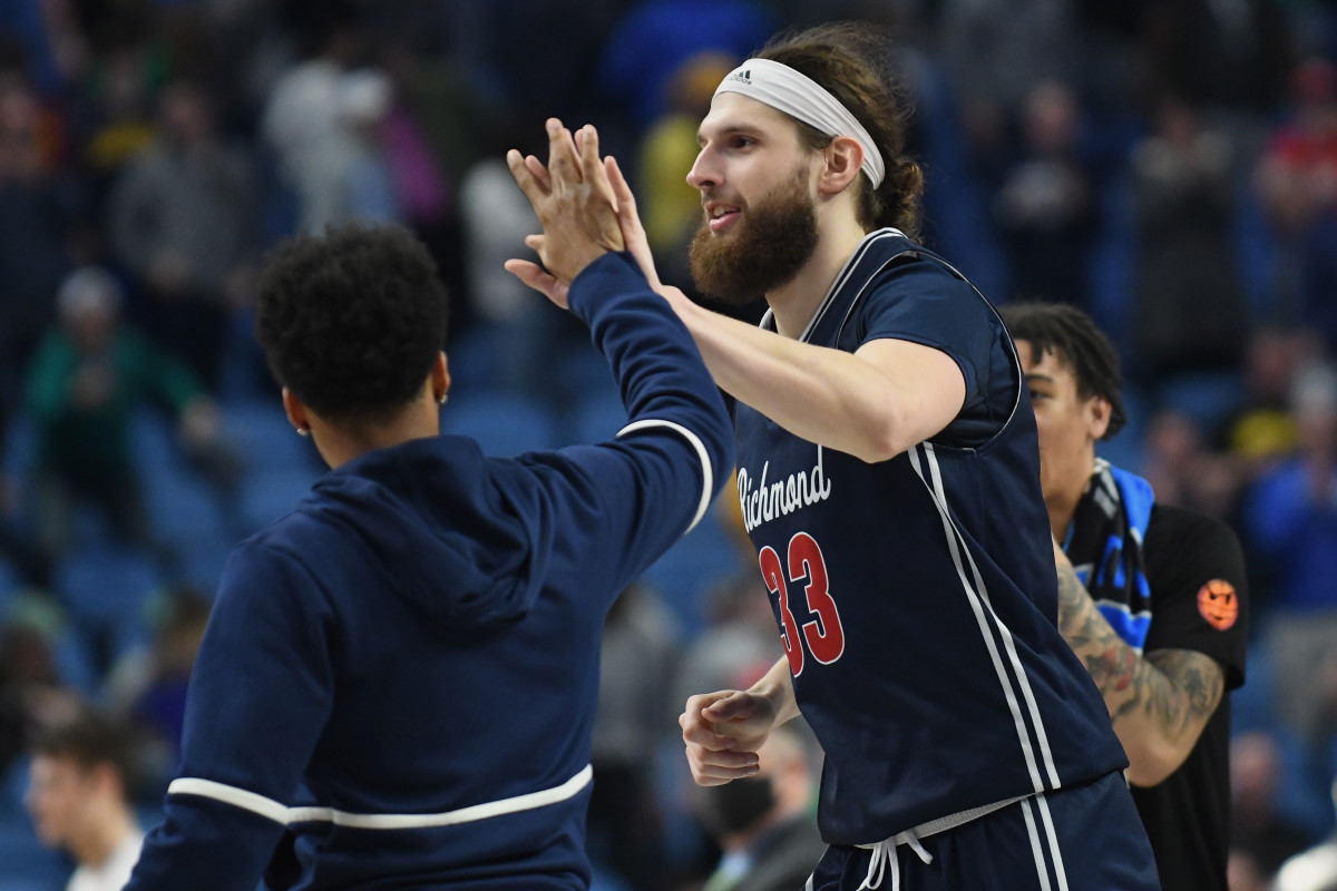 Richmond Spiders forward Grant Golden (33) celebrates after defeating the Iowa Hawkeyes during the first round of the 2022 NCAA Tournament at KeyBank Center.