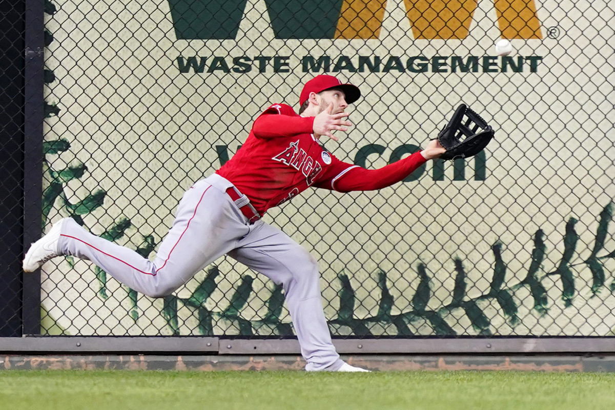 Los Angeles Angels right fielder Taylor Ward catches a fly out by Philadelphia Phillies’ Nick Castellanos during the first inning of a baseball game, Friday, June 3, 2022, in Philadelphia.