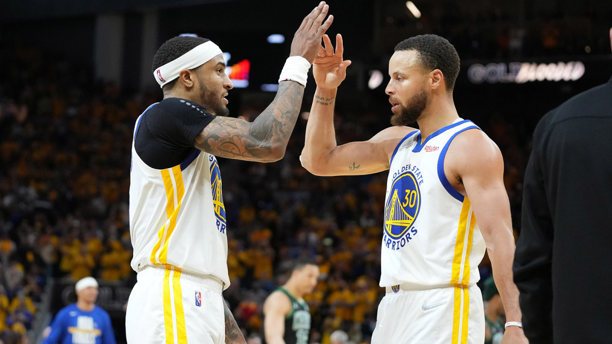 Golden State Warriors guard Stephen Curry (30) celebrates with guard Gary Payton II.