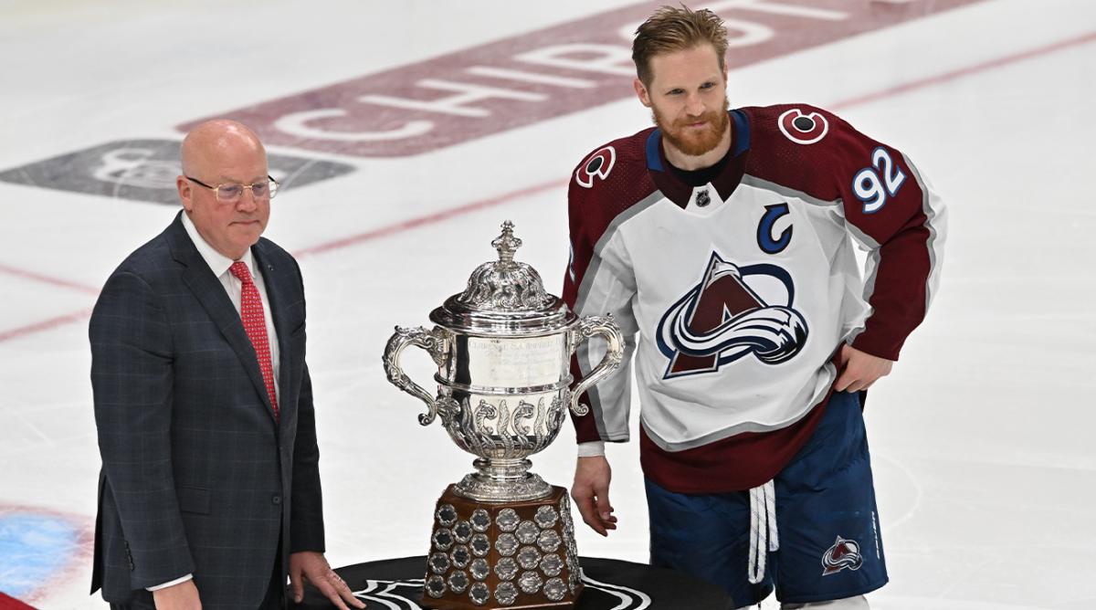 Jun 6, 2022; Edmonton, Alberta, CAN; Colorado Avalanche forward Gabriel Landeskog (92) stands with Deputy Commissioner Bill Daly before being presented with the Clarence S. Campbell Bowl in game four of the Western Conference Final of the 2022 Stanley Cup Playoffs at Rogers Place.