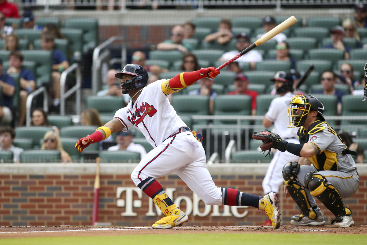 Jun 11, 2022; Atlanta, Georgia, USA; Atlanta Braves right fielder Ronald Acuna Jr. (13) hits a home run against the Pittsburgh Pirates in the first inning at Truist Park.