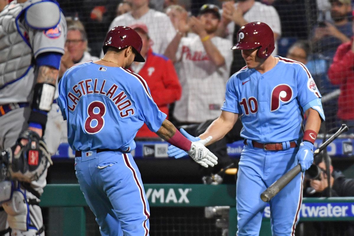 Nick Castellanos high-fives J.T. Realmuto after hitting a home run against the New York Mets.