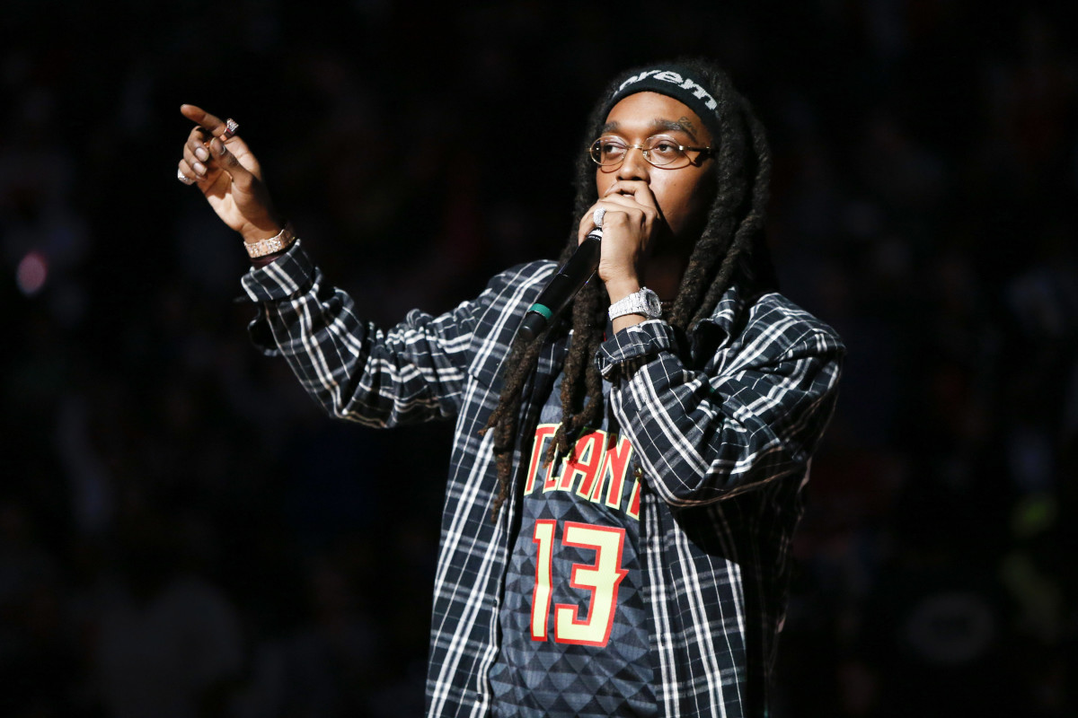 Takeoff from the hip-hop group Migos performs during halftime of a game between the Memphis Grizzlies and Atlanta Hawks at Philips Arena.