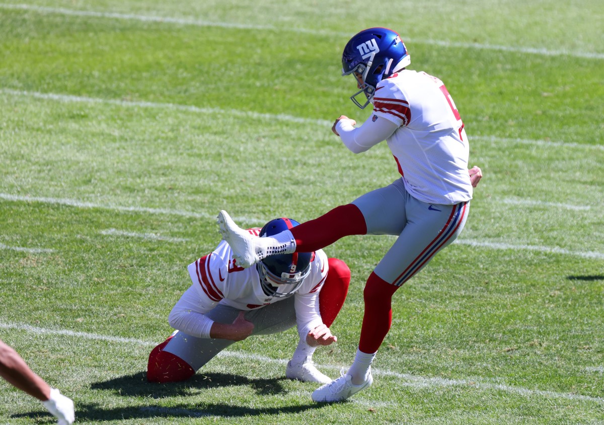 Sep 20, 2020; Chicago, Illinois, USA; New York Giants kicker Graham Gano (5) kick a field goal against the Chicago Bears during the third quarter at Soldier Field.