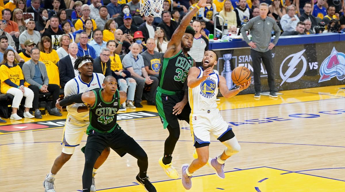 Jun 13, 2022; San Francisco, California, USA; Golden State Warriors guard Stephen Curry (30) goes to the basket while defended by Boston Celtics guard Marcus Smart (36) during the second half in game five of the 2022 NBA Finals at Chase Center.