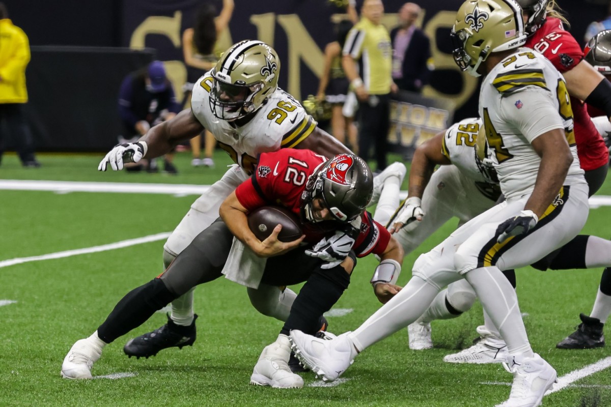 Tampa Bay Buccaneers quarterback Tom Brady (12) is sacked by New Orleans Saints defensive end Tanoh Kpassagnon (90). Mandatory Credit: Stephen Lew-USA TODAY Sports